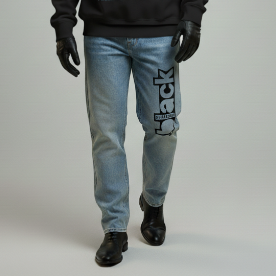 Man wearing a black sweatshirt with graphic design and text, standing against a plain background