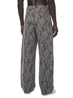 Jeans unisexe coupe large délavé imprimé léopard