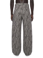 Jeans unisexe coupe large délavé imprimé léopard